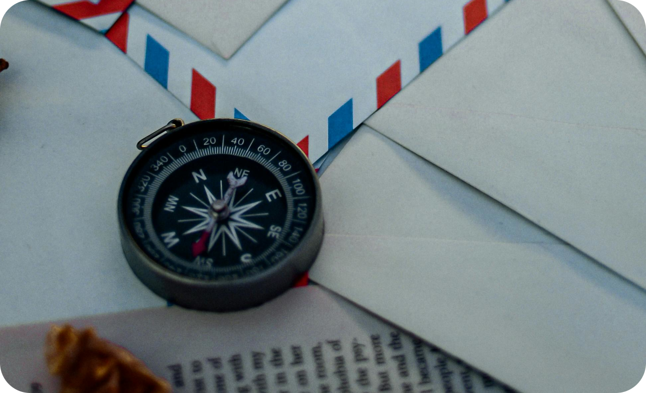 Photo by Samah Mahdi from Pexels: https://www.pexels.com/photo/a-compass-and-mail-envelopes-on-the-table-6650768/